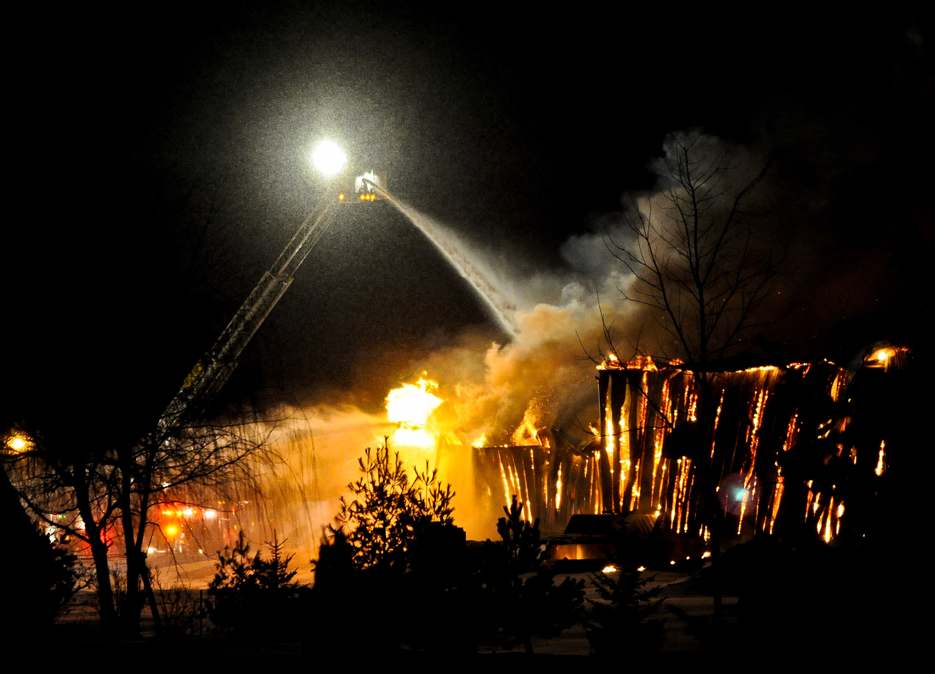 Several area fire departments battled a blaze Friday evening at the Heritage Aluminum & Brass Foundry, 107 W. Liberty Drive, St. Nazianz. The fire was reported around 8:30 p.m. and law enforcement officers were called in to control traffic near the scene. Doug Sundin/HTR February 25, 2011 St. Nazianz. Printed in the Herald Times Reporter on 02/26/2011. First place in the NPPA's February 2011 Monthly Clip Contest in Region 5.