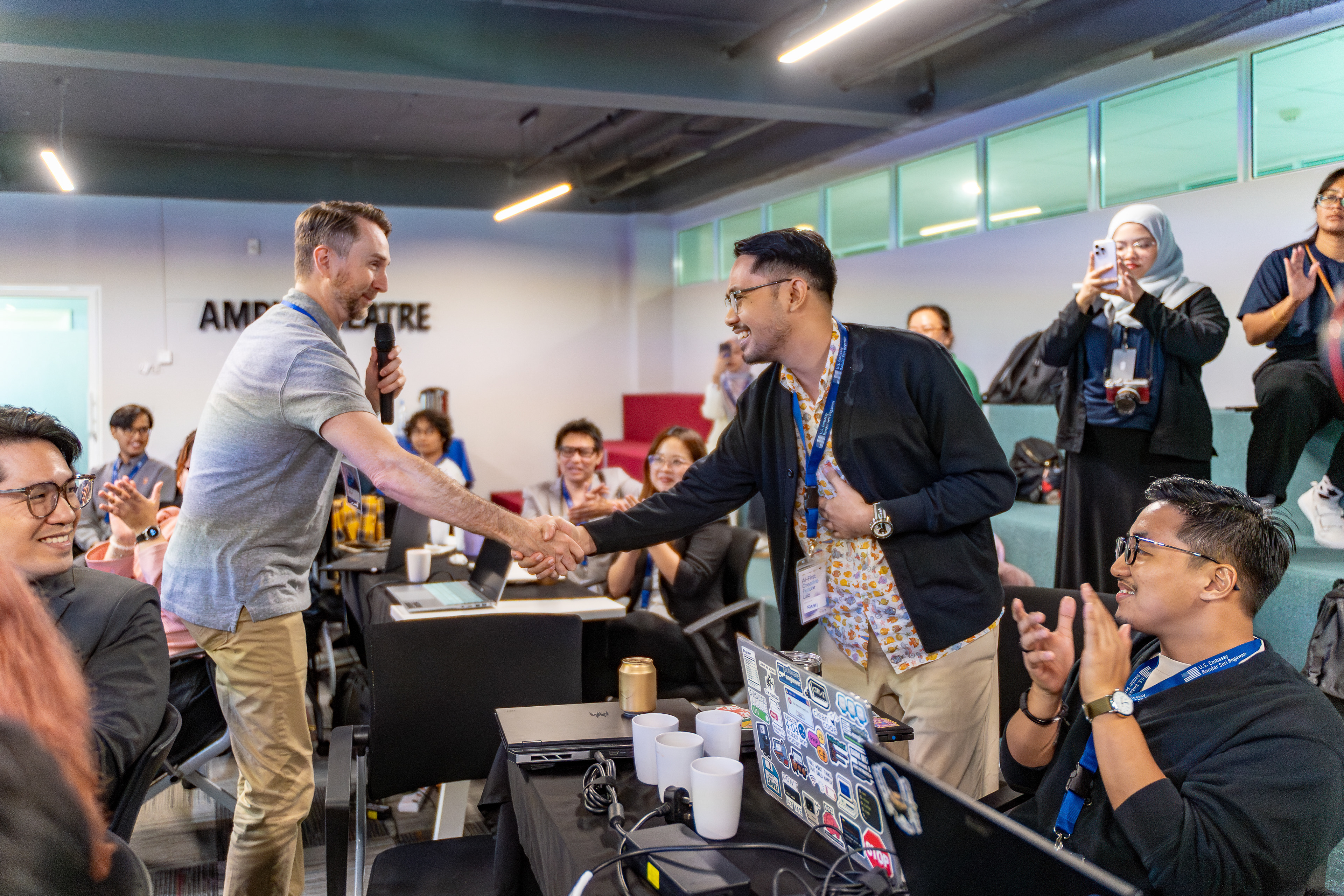 Cam & Fahmi Rosli shaking hands @ AI 1st Creative Future Lab | Apr 2026