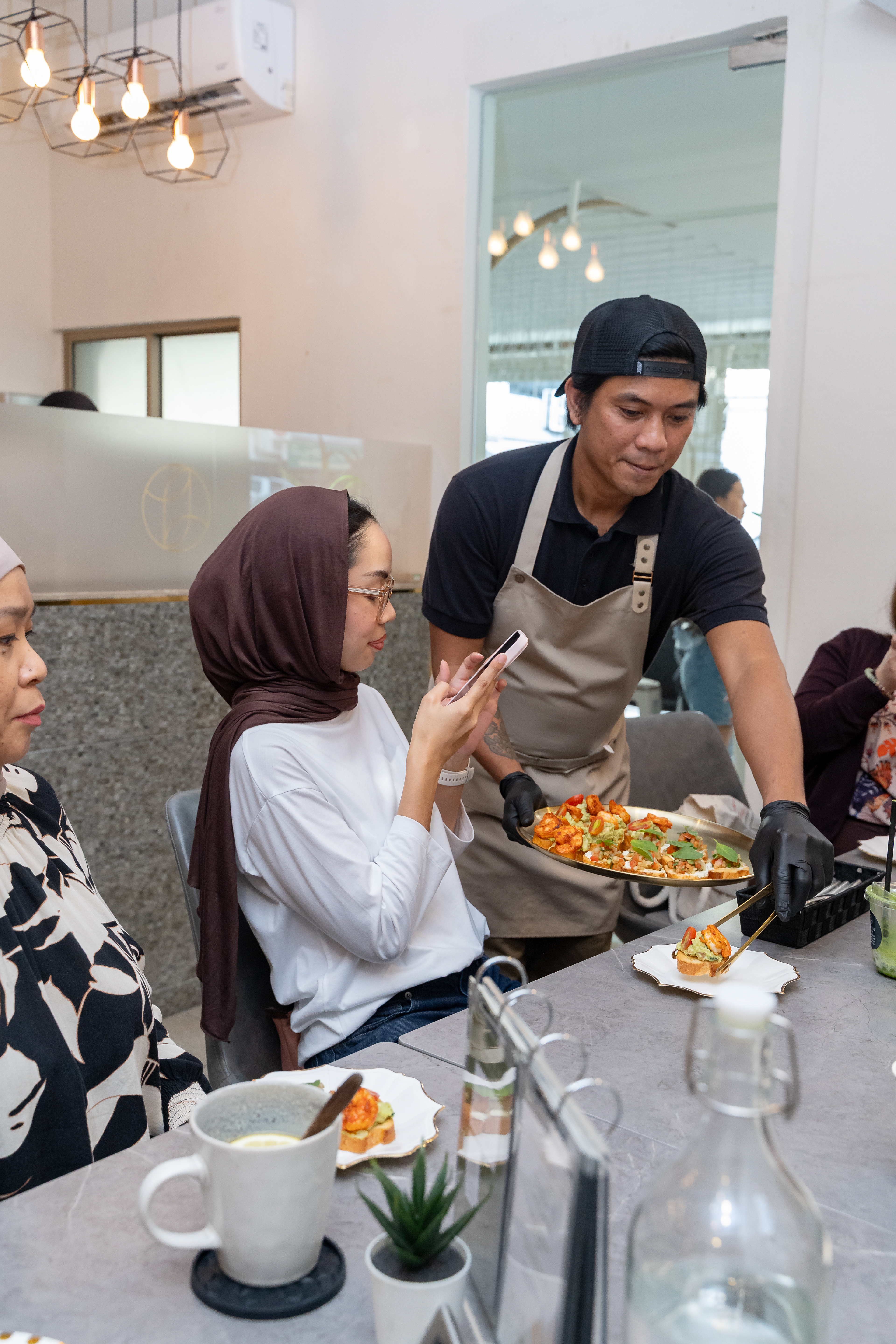 Social influencers at work @ Version 3 relaunch of Yin Yang Cafe | Jul 2026