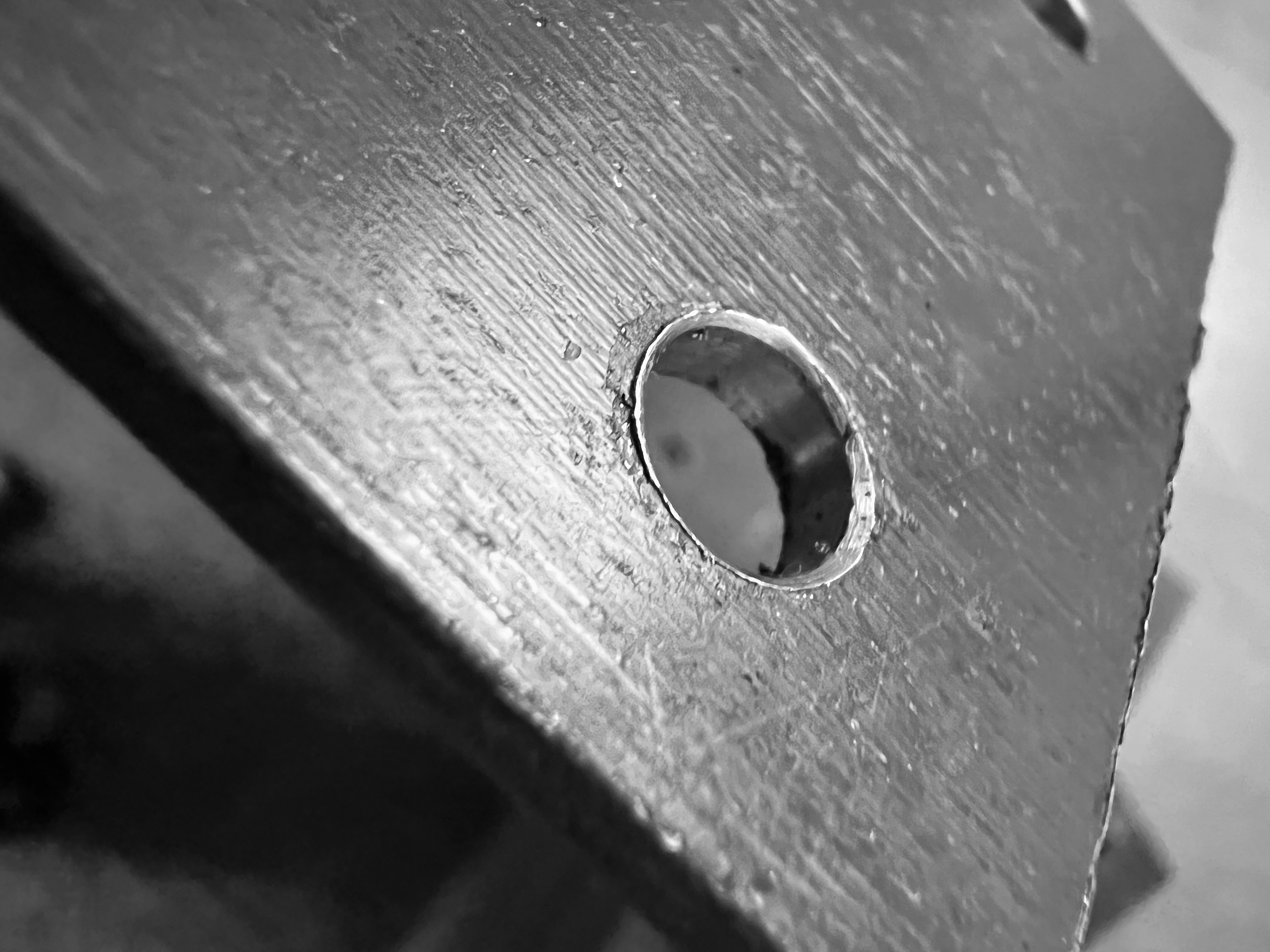 After drilling, I deburred the holes to make sure they weren't sharp and had a nicer appearance (even though they'd be under screws.
