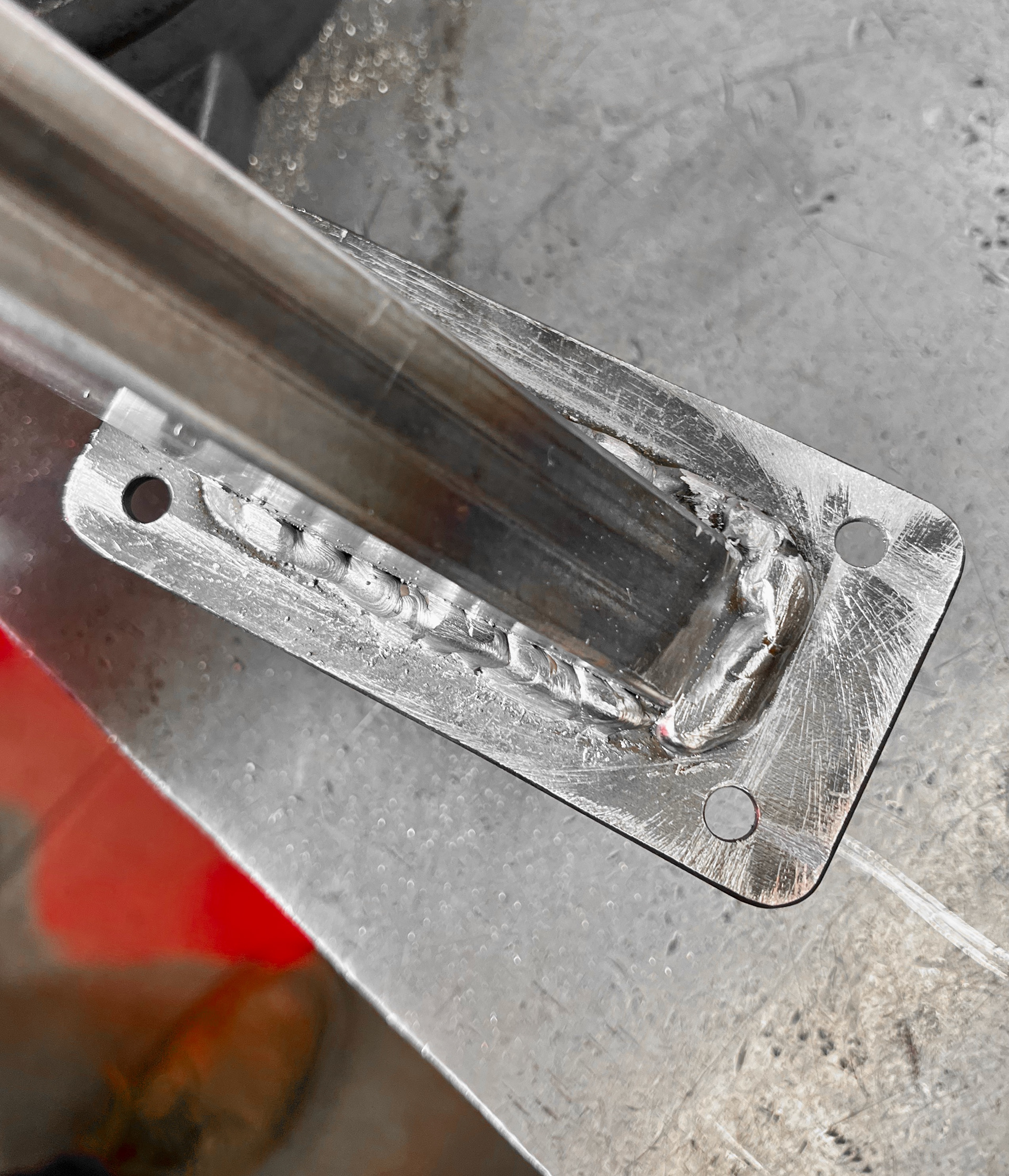 I sanded and filed the welds down (with the plates getting in the crossfire, unfortunately).
