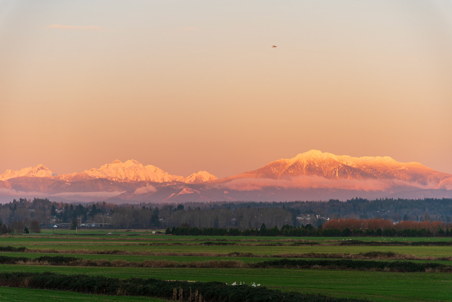 The Cascade mountains with Snohomish in foreground at sunset in December