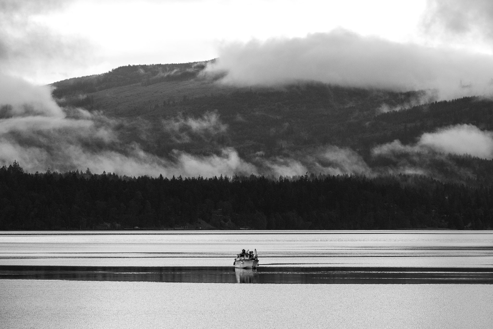 A boat sits at its mooring in Sequim Bay, Sequim, WA