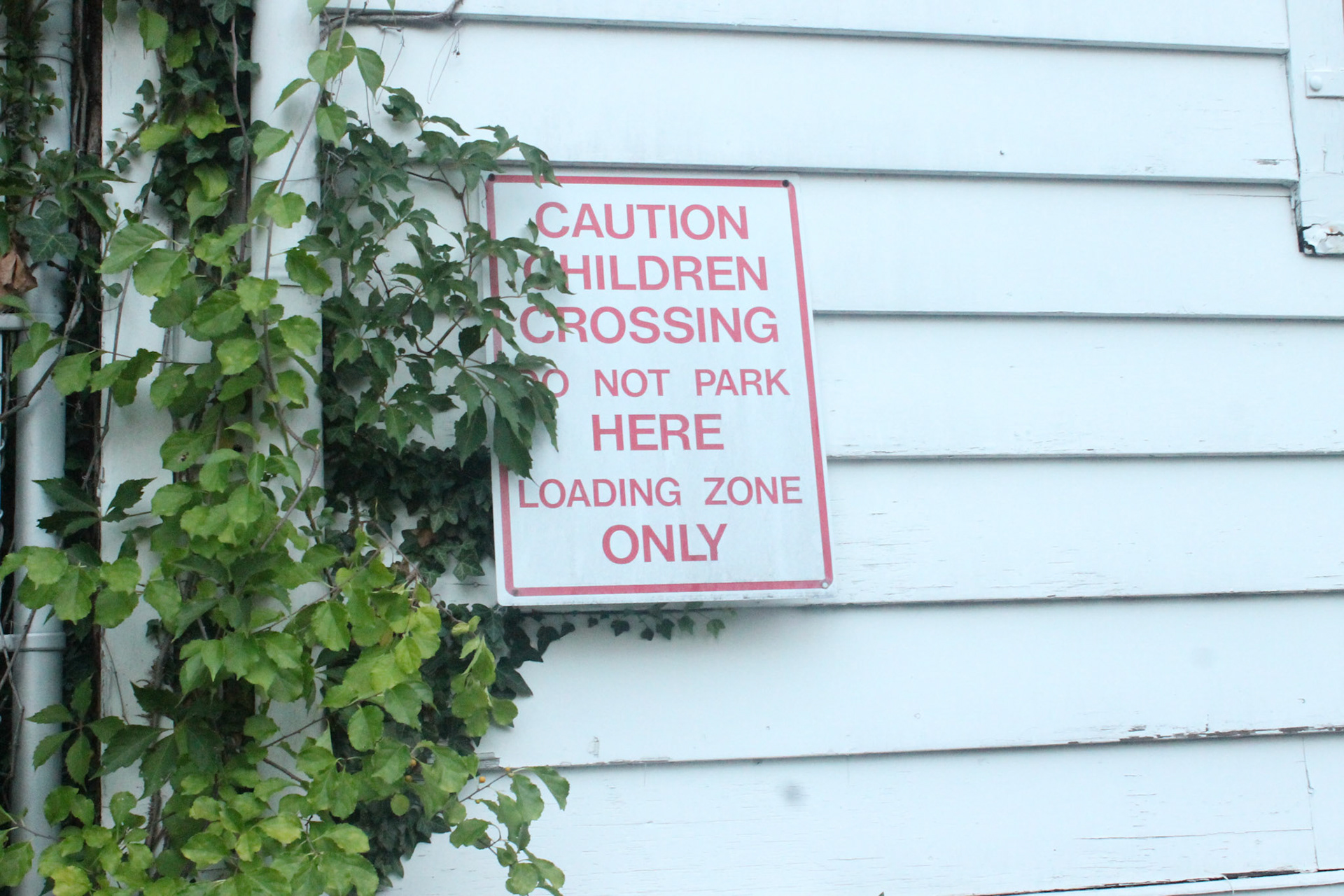 A caution sign hangs on an abandoned mansion in Reservoir Hill, Baltimore; Wednesday, September 22, 2022.