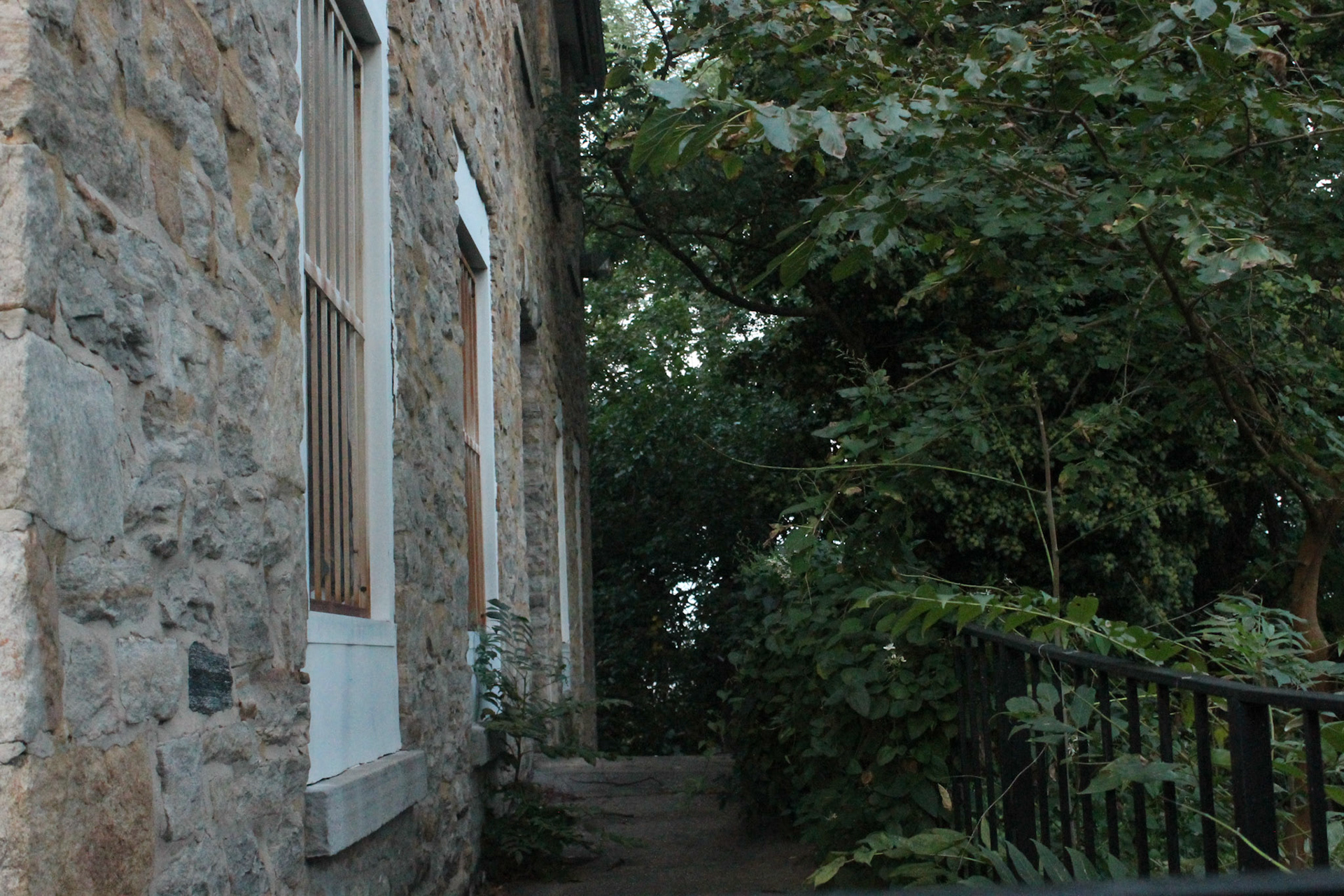 A trail leads to the rear of an abandoned mansion in Reservoir Hill, Baltimore; Wednesday, September 22, 2022.