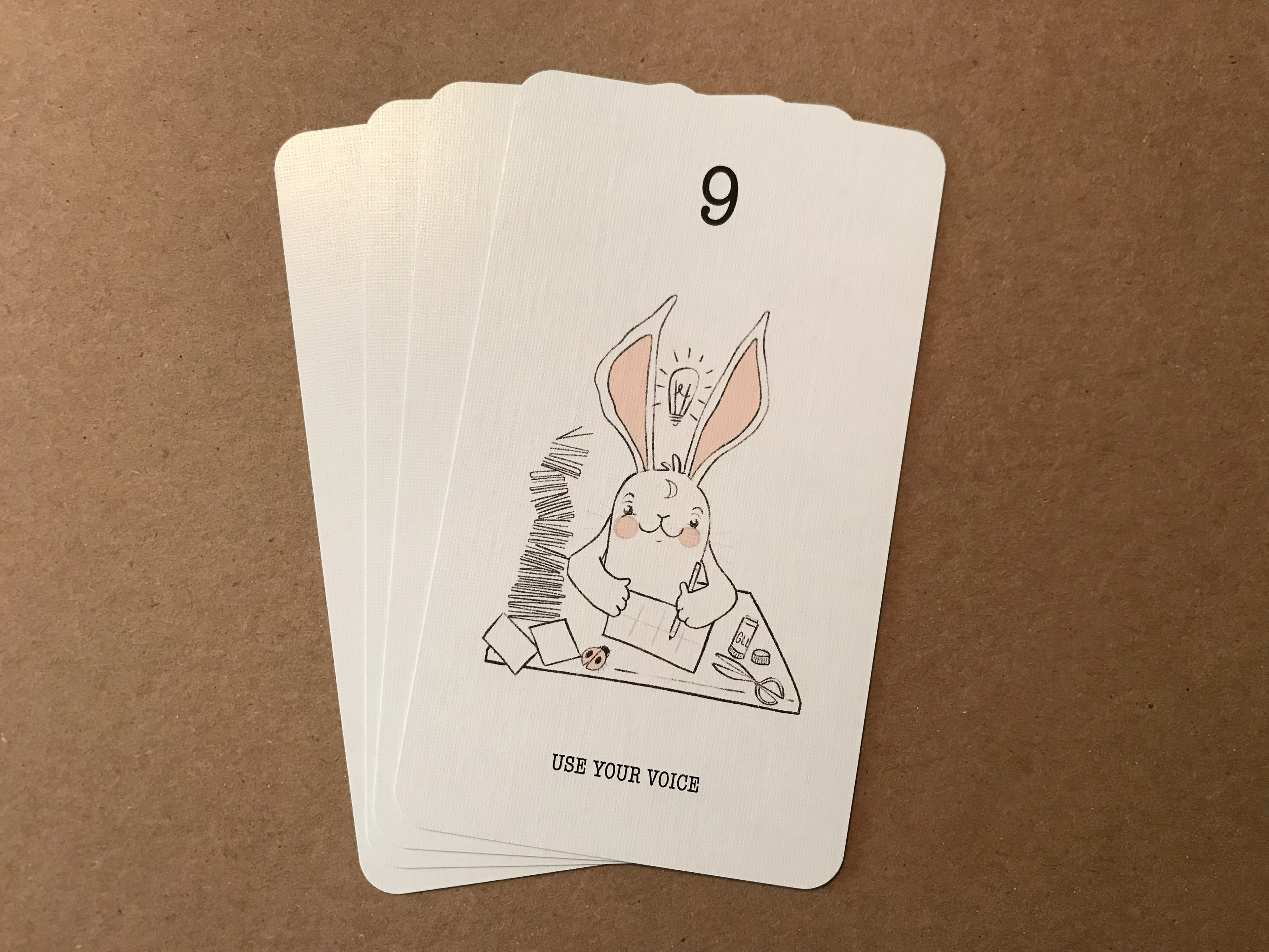 Moon Rabbit (me) making zines, the ladybug is my daughter.