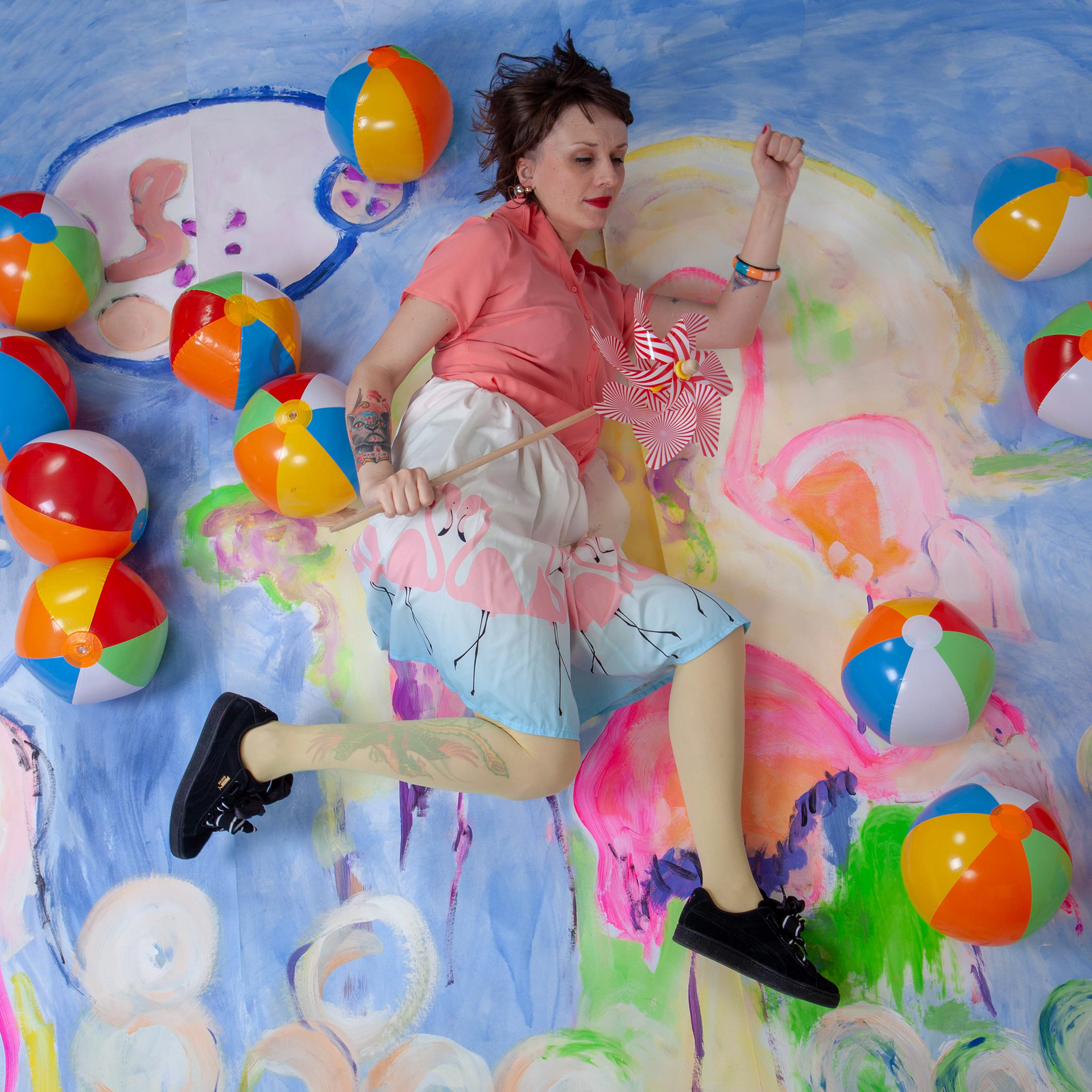 Artist Honorata Maria Gawronska and her painting in the background created for the photograph.