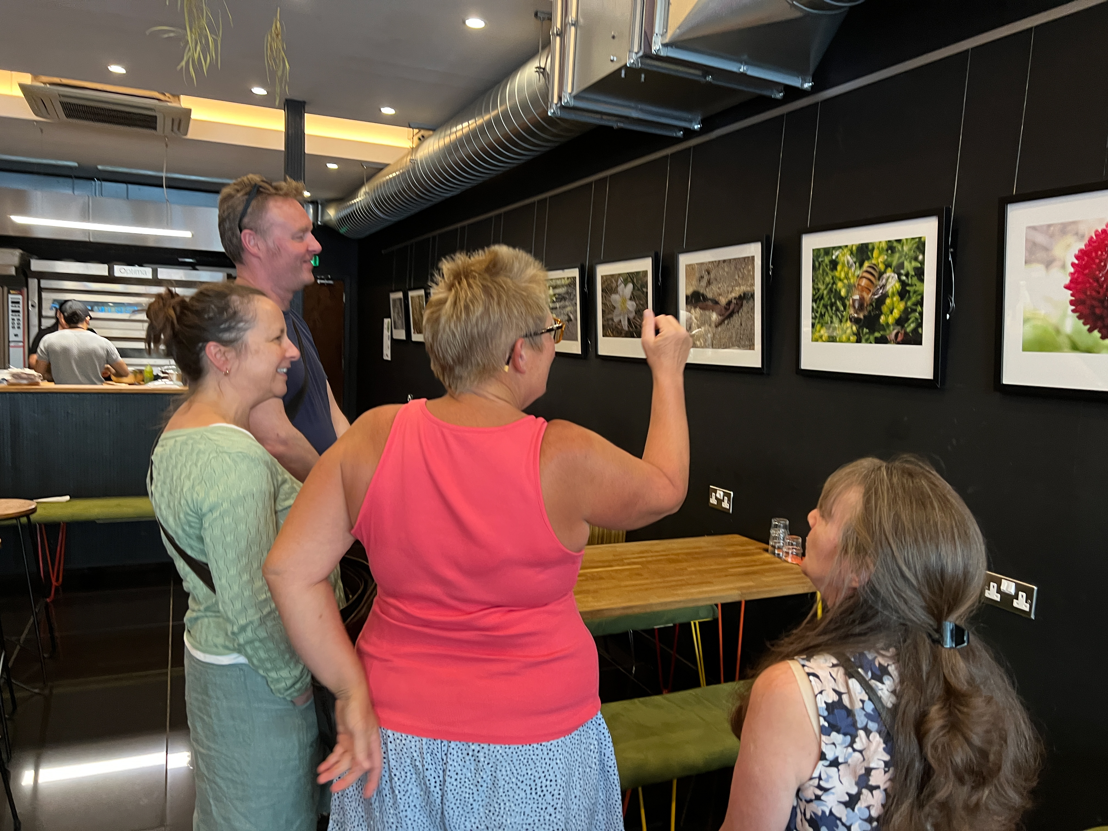 Guests admiring Emma's photos