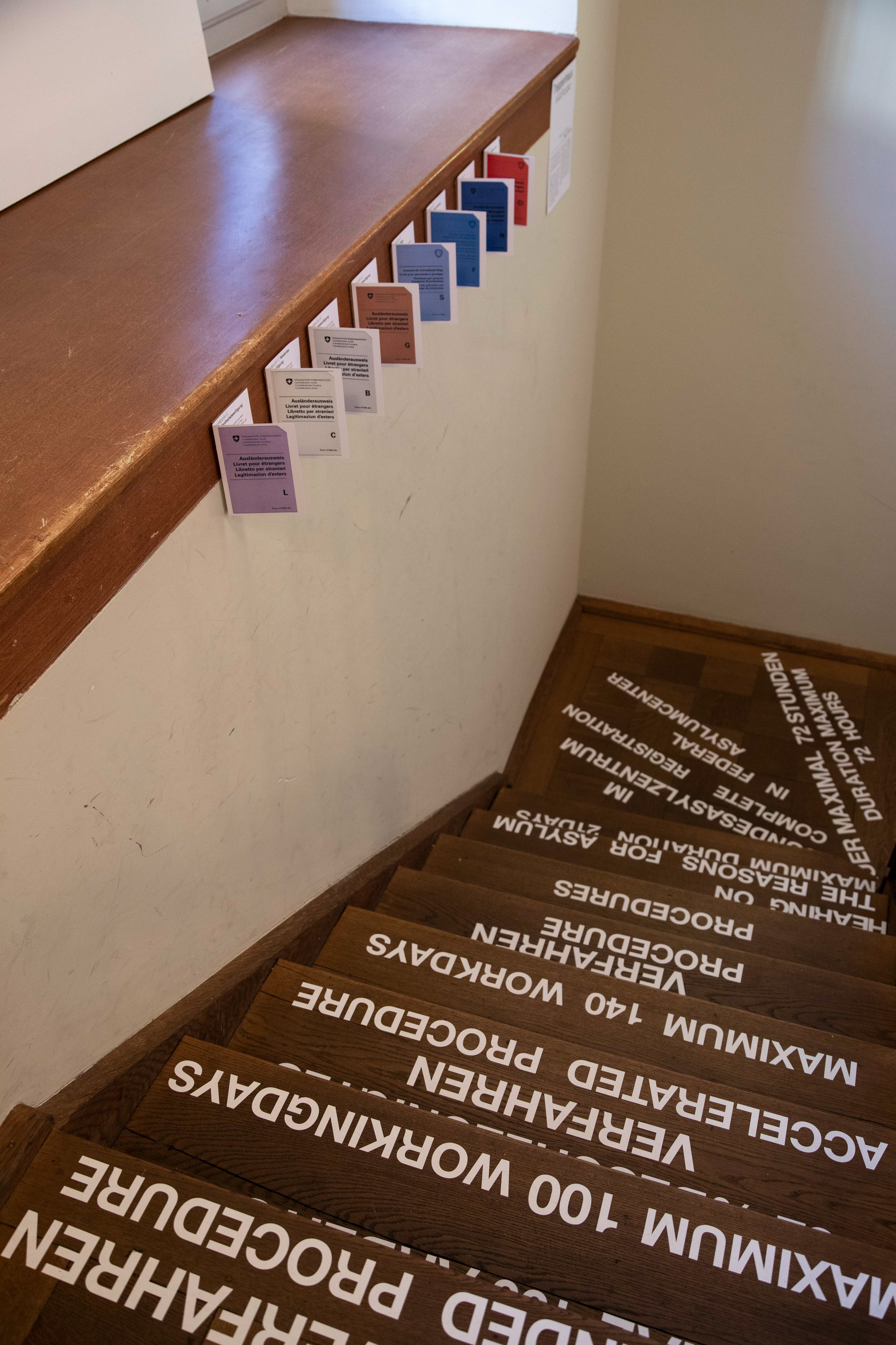 The staircase with the different residence permits in Switzerland.