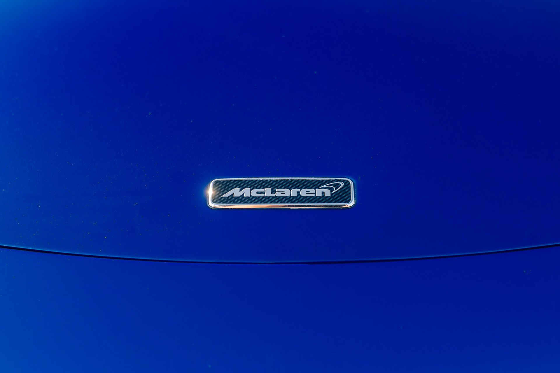 McLaren 650S Spider emblem macro detail.