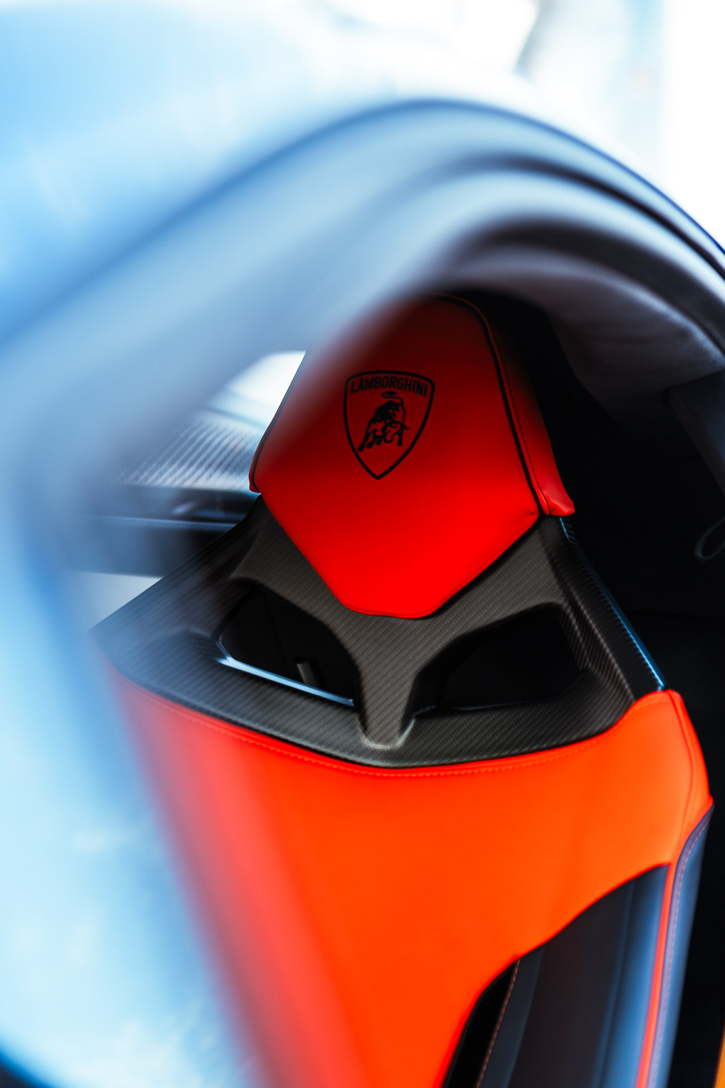 Close-up of the Lamborghini Revuelto's raised scissor door and badge