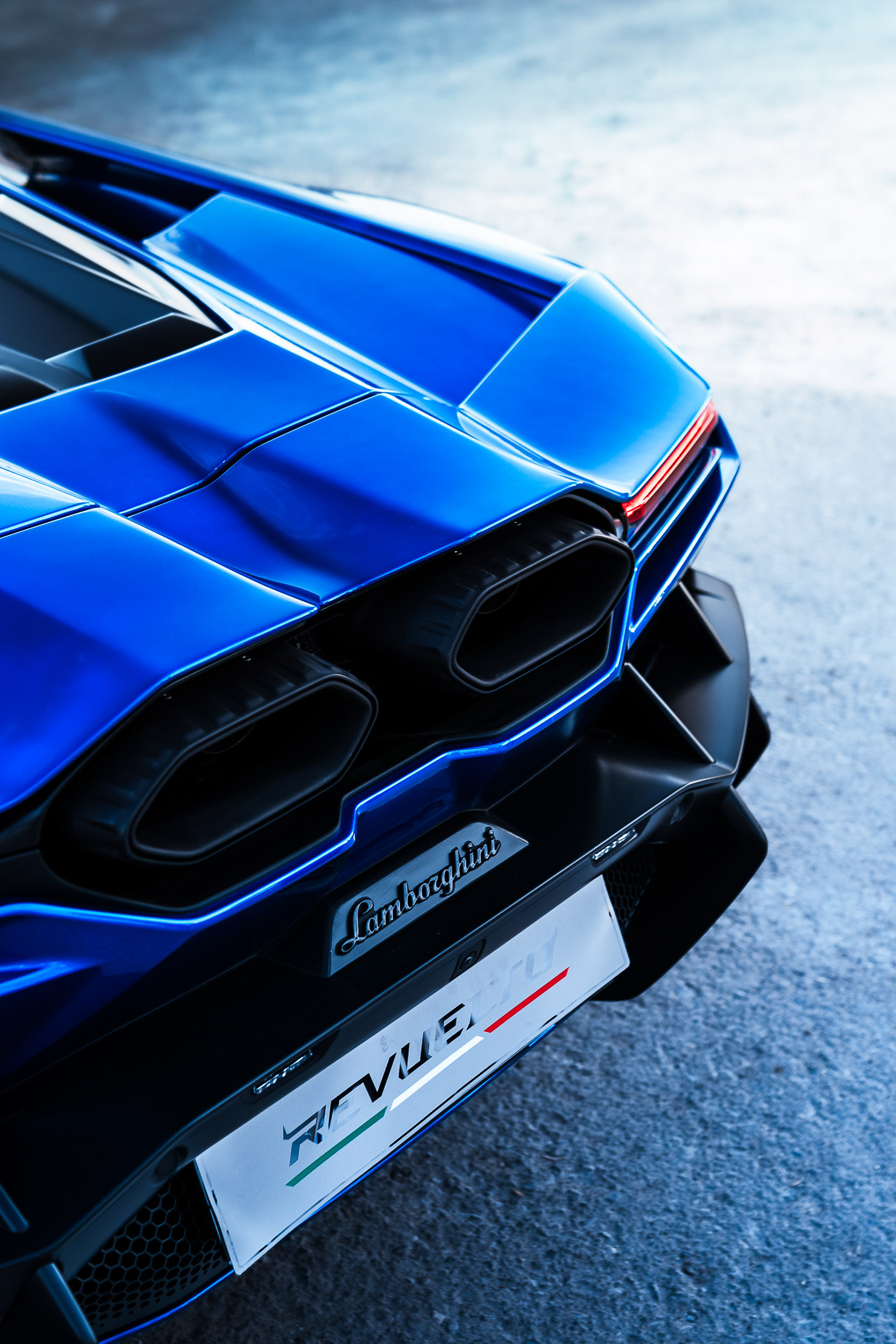 Lamborghini Revuelto rear badge and taillight detail with REVUELTO license plate