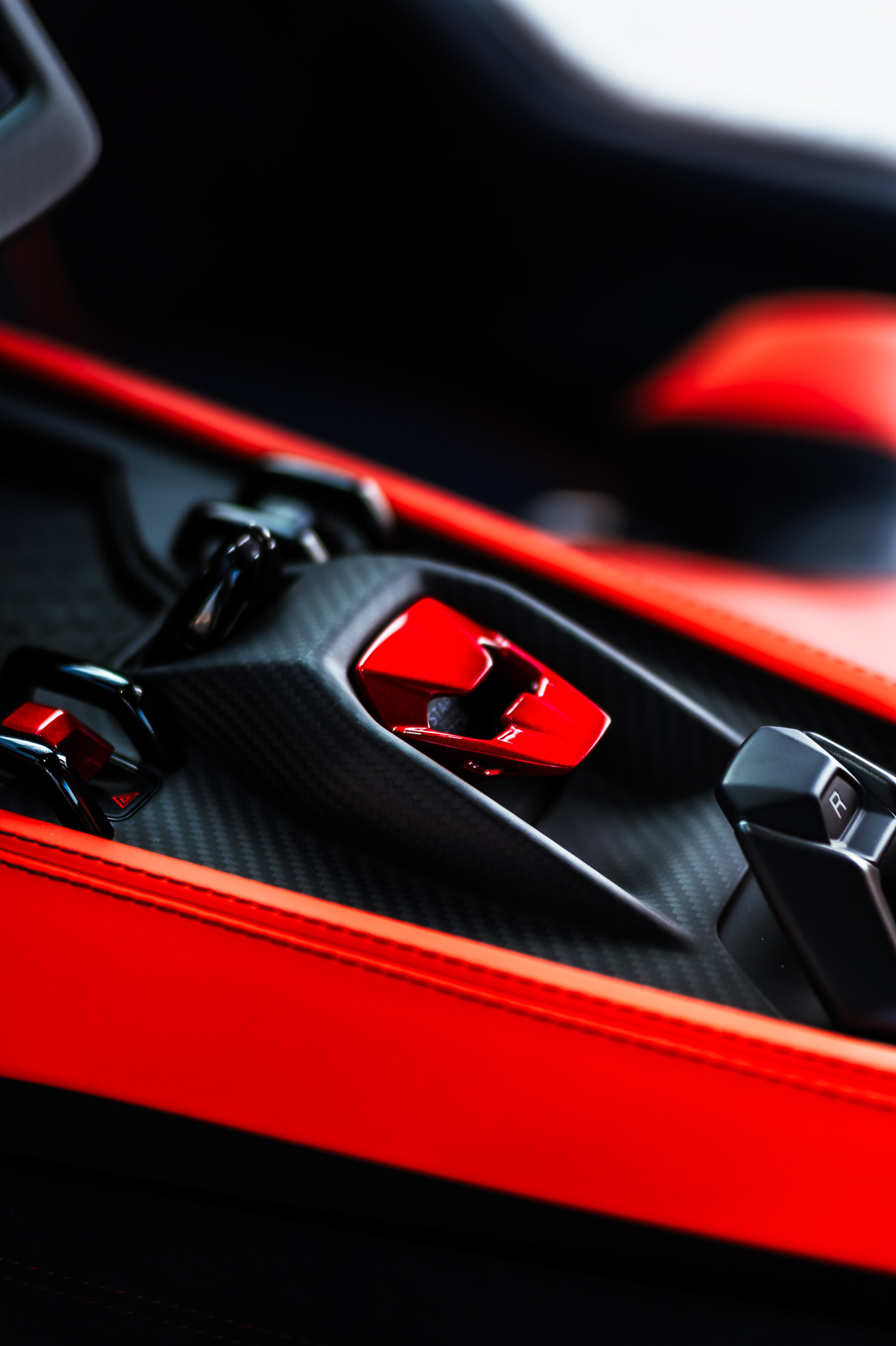 Lamborghini Revuelto red center console with gear selector buttons