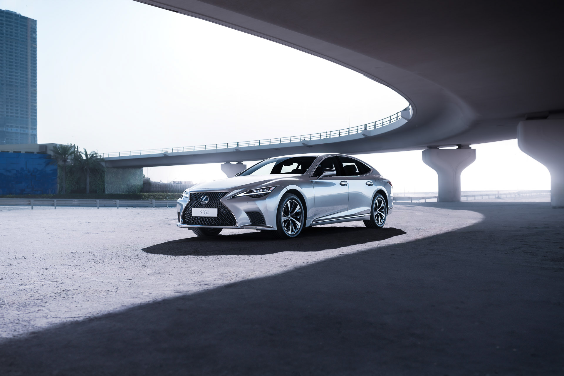 Lexus LS 350 2024 photographed under curved bridge, soft shadow and architectural framing