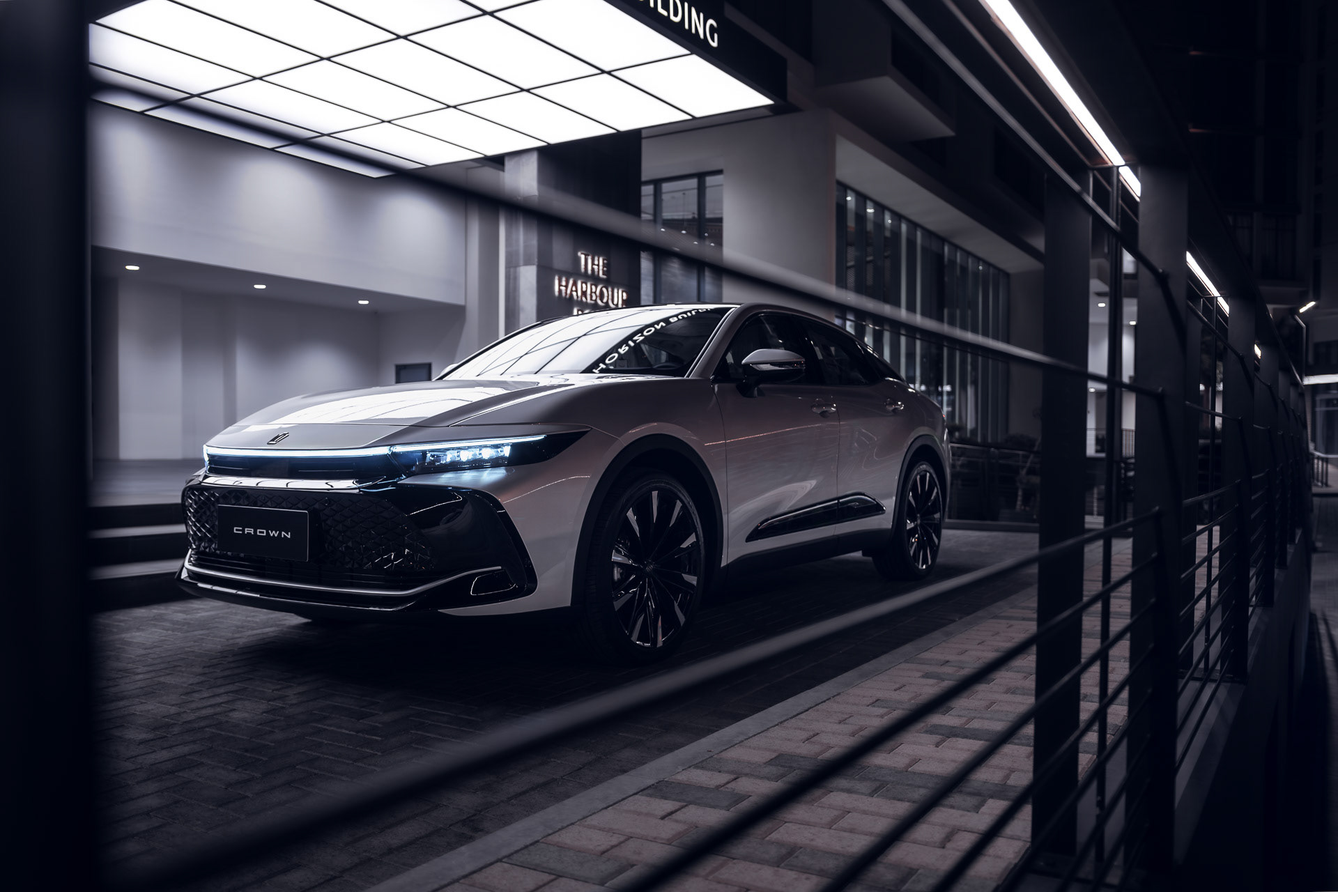 2023 Toyota Crown, front 3/4, Manama Harbour, night lights