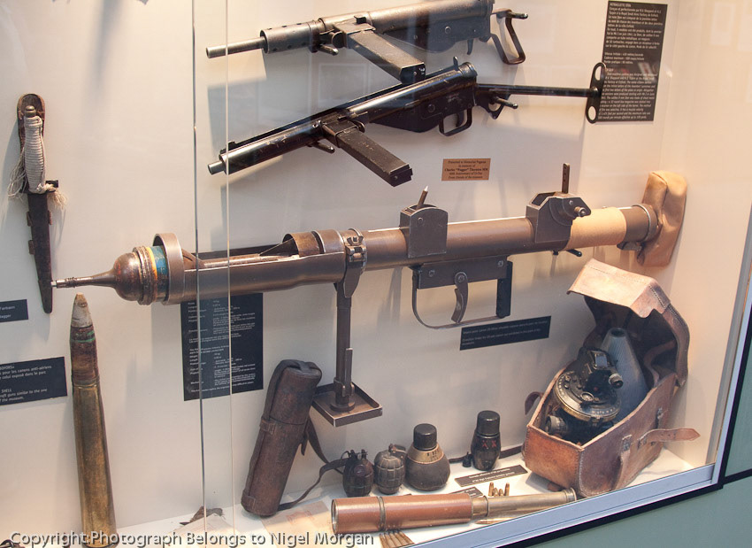 PIAT (Projector Infantry Anti-Tank) bomb launcher. 5-6 rounds / minute. This was the largest amunition used to defend the bridge.