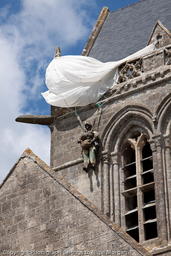 The actual paratrooper on D-Day was John Steele. 'F' Company 82nd Airborne.