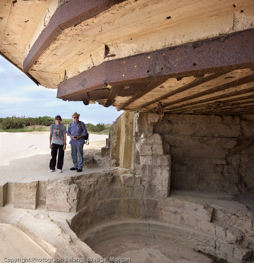 The Rangers found that the "guns" were telephone poles. Tracks leading inland indicated that the 155mm cannon had been removed recently, almost certainly as a result of the preceding air bombardment.