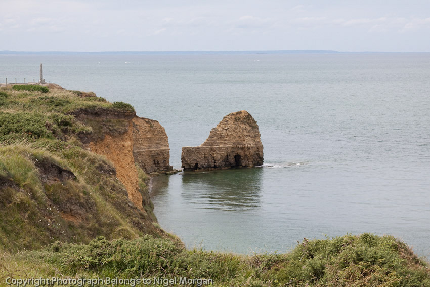 The basic method of climbing was by rope. Each LCA carried three pairs of rocket guns, firing steel grapnels which pulled up plain three-quarter-inch ropes, toggle ropes, or rope ladders. The rockets were fired just before touchdown. Grapnels with attached ropes were an ancient technique for scaling a wall or cliff, tried and proven. But in this case, the ropes had been soaked by the spray and in many cases were too heavy.