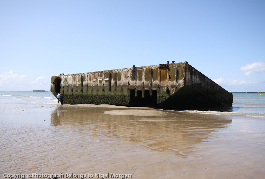Mulberry harbour section on beach, hollow inside.