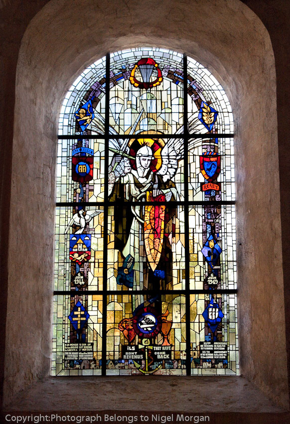 Stained glass window inside Church. Note parachute at top of window.