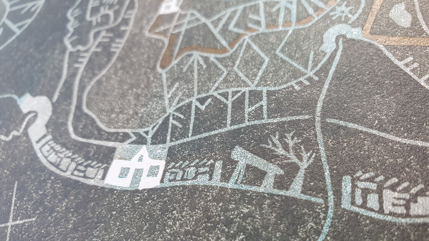 A close-up photograph of a linocut print with shades of brown over teal, with a gold line through, a white hose and runic symbols.
