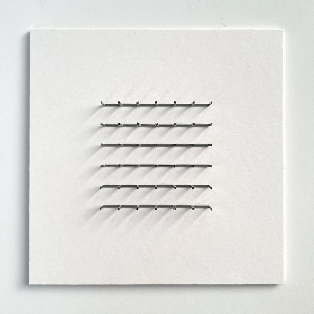 6 lines, 10th August, 36 staples on paper