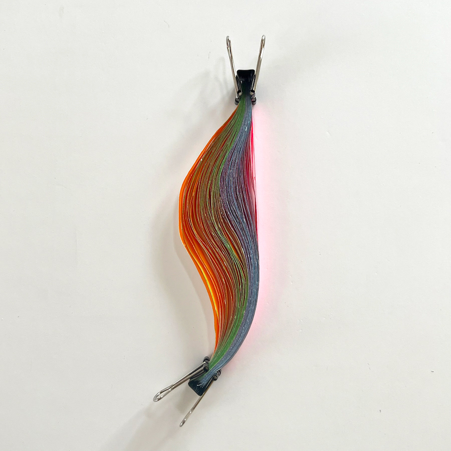 94 lines, 6th November, strips of party streamers left over after a party. The strips are all 15cm long. They want to curl, hence the shape of the bunch.