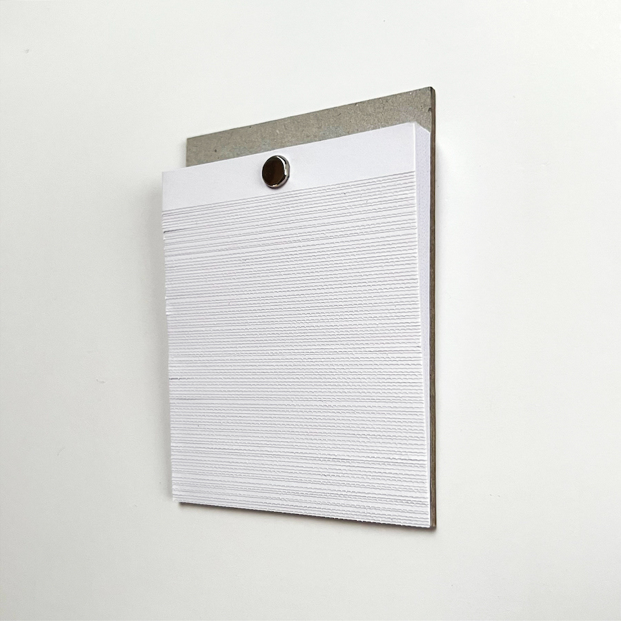 98 lines, 10th November, ribbed edges of 98 sheets of paper torn from a mini notepad. They were then cut, re-stacked and re-attached.