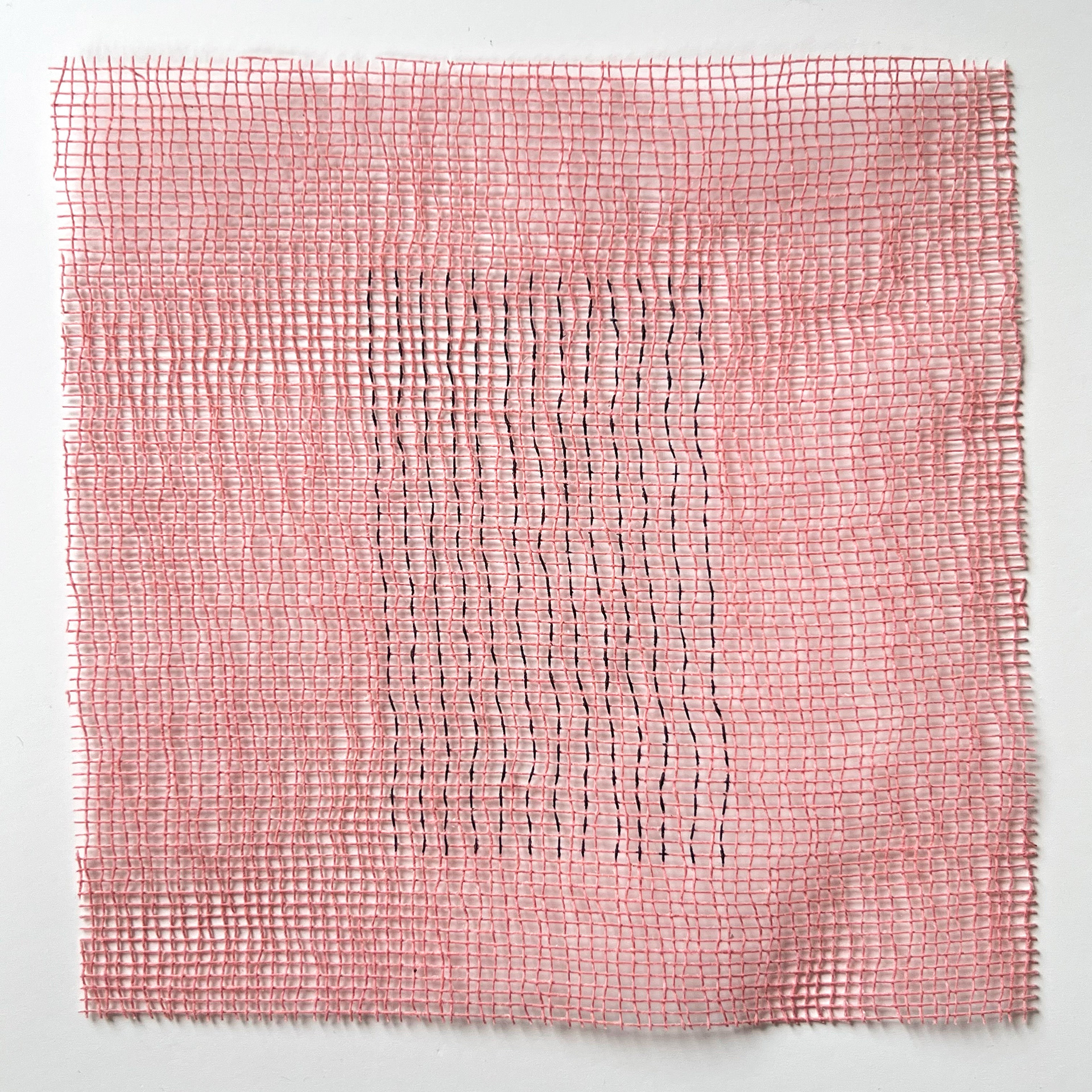 325 lines, 24th June, marker pen on a piece of fabric mesh (recycled gift wrap). 13 rows of 25 verticals