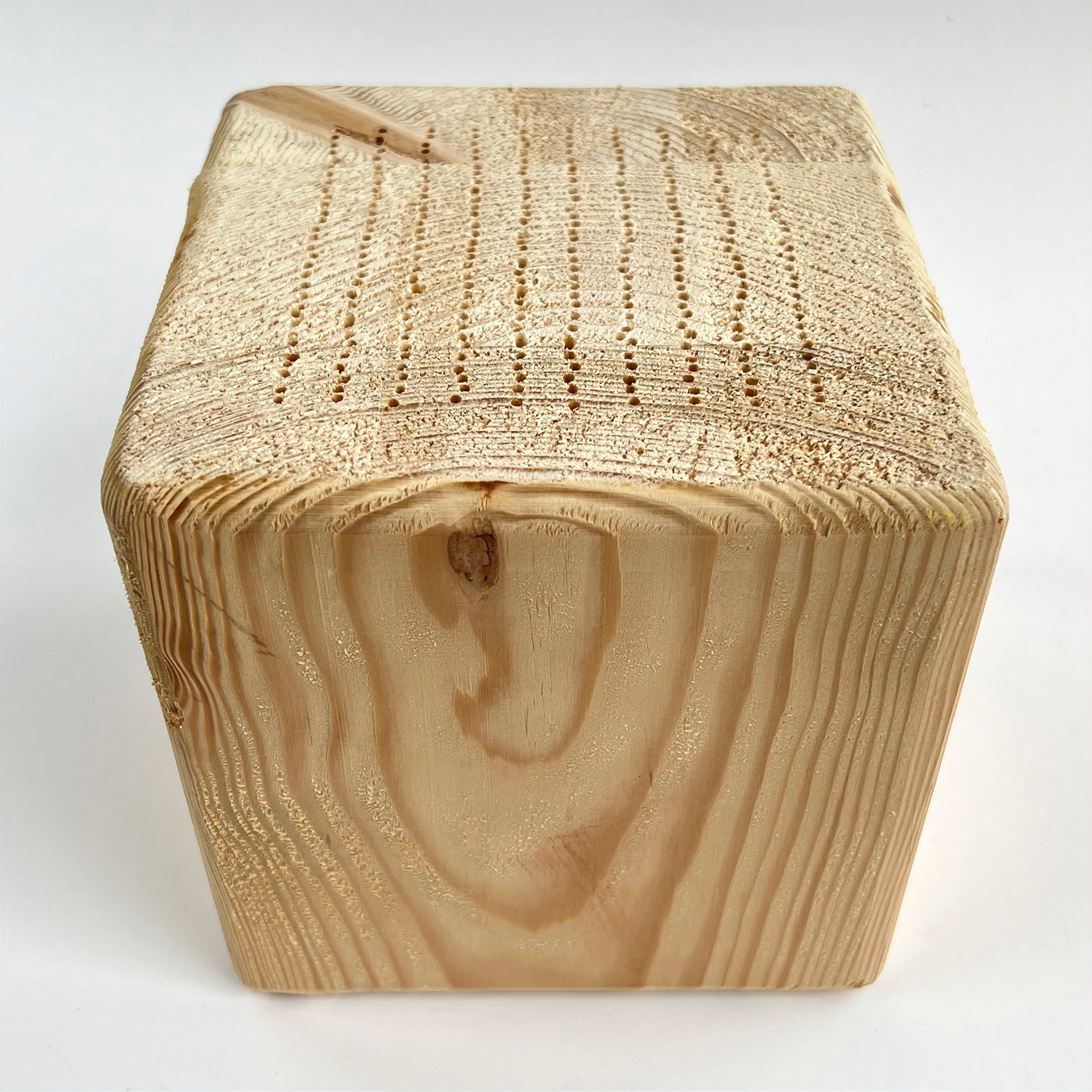 310 lines, 9th June, 310 lines drilled in wood. The lines are defined by the wood that surrounds them. About 2 cm deep lines in a 15x15x15 cm wood block