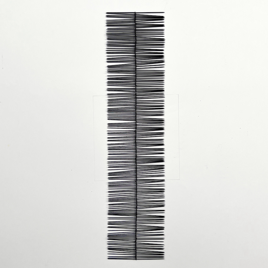 314 lines, 13th June, 314 nails glued together. The nails are 5 cm long. I intended to turn the object into a circle so the nails would stand upright. Its diameter would have been approx 14 cm. But it broke. So today’s drawing extends quite a bit beyond the 15x15cm size that I chose at the start of this drawing year: it is 10x43 cm