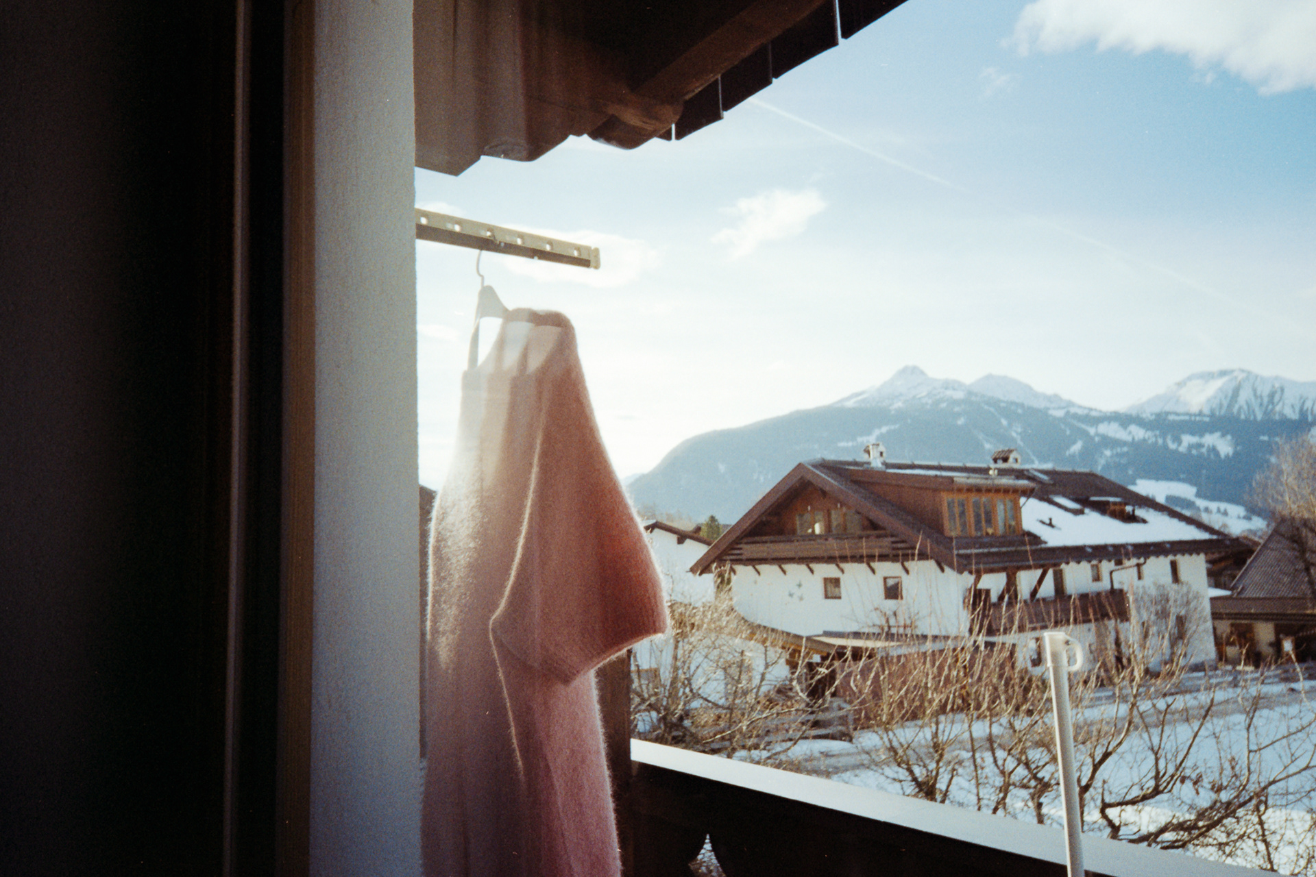 35mm film photo of shirt hanging in front of sun, Kodak Snapic A1 sample image.