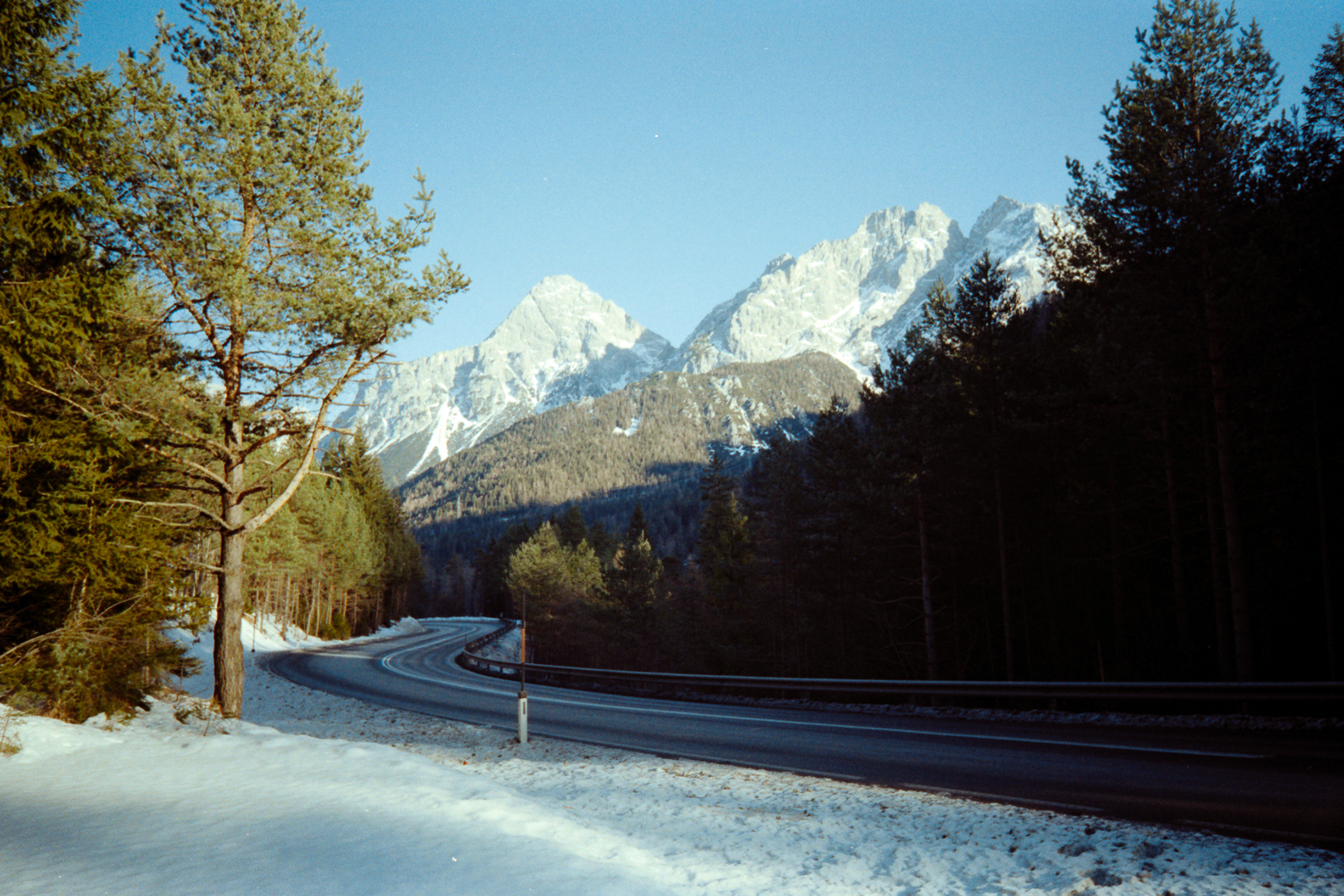 35mm film photo of road and mountains, shot on the Kodak Snapic A1 in Austria