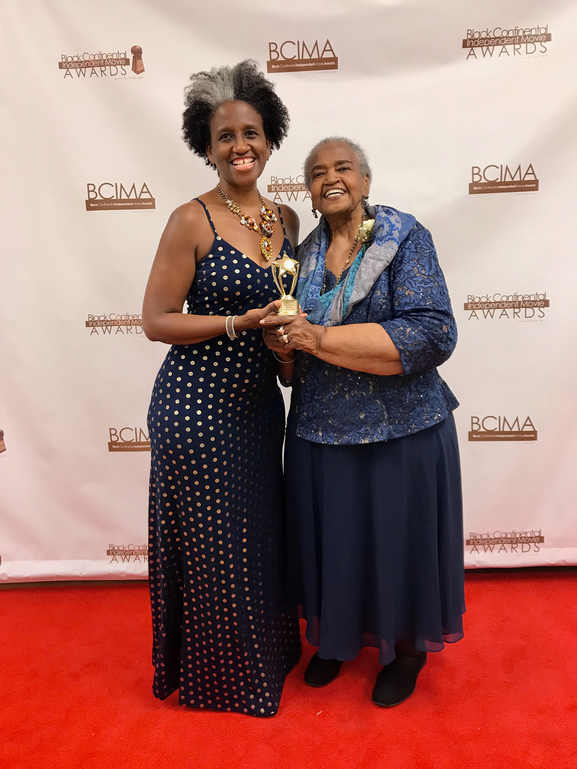 Rev. Woolford with her daughter Pamela Woolford at the 2019 BCIMA (Black Continental Independent Movie Awards), aka Black Cinema Awards, ceremony, after their win for Originality for their film Generation.