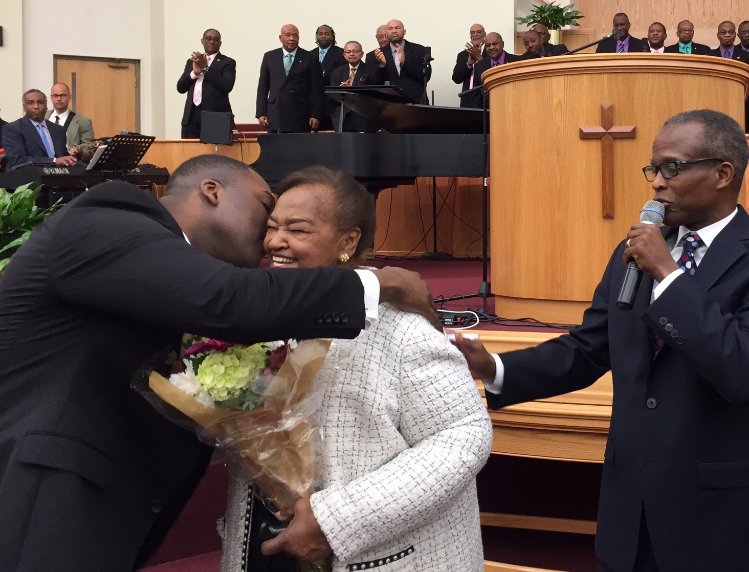 Rev. Woolford gets a a congratulatory kiss from Howard County Executive Calvin Ball.