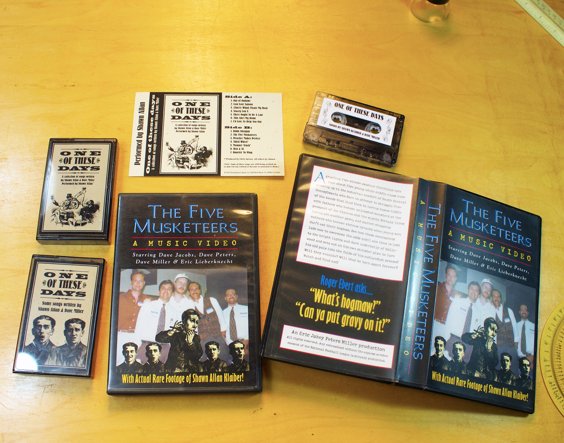 A DVD and VHS box containing a short film celebrating a friend's 40th birthday. Also cassette tape packages for songs written by that same friend and I.
