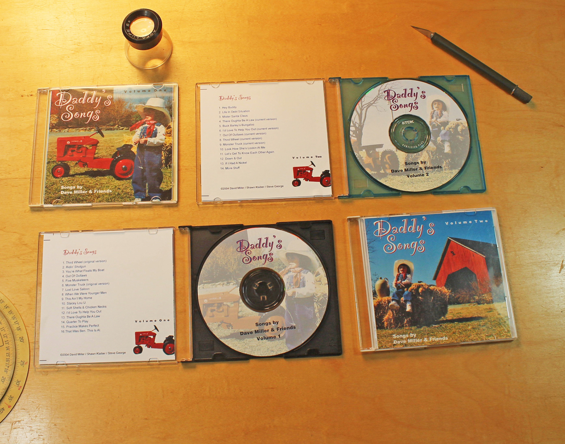 CD jewel boxes for collections of songs written by yours truly.