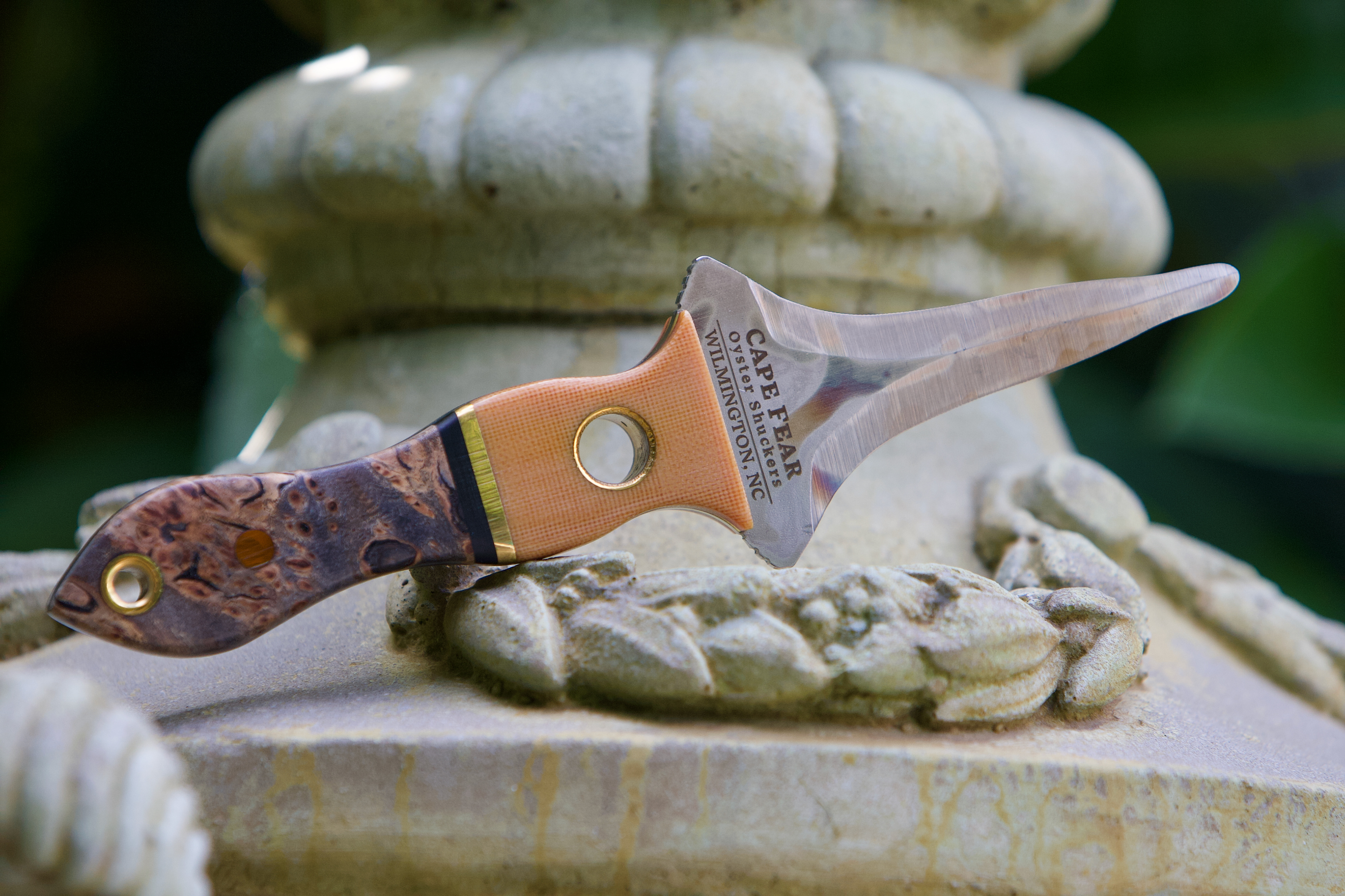 #35 Canvas Micarta and Mystery Burl, brass accents
