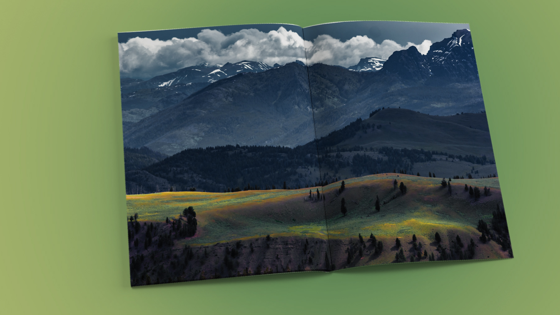 Painterly landscape image of mountains and rolling hills