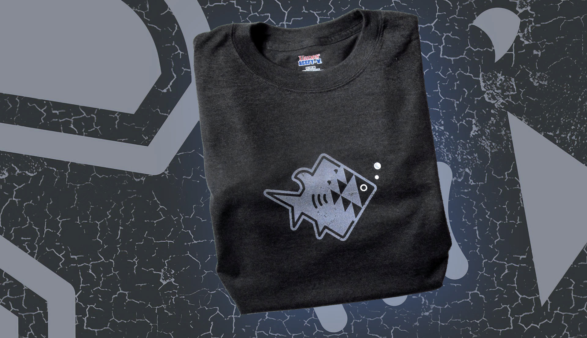 T-shirt of an illustrated fish being attacked by a shark