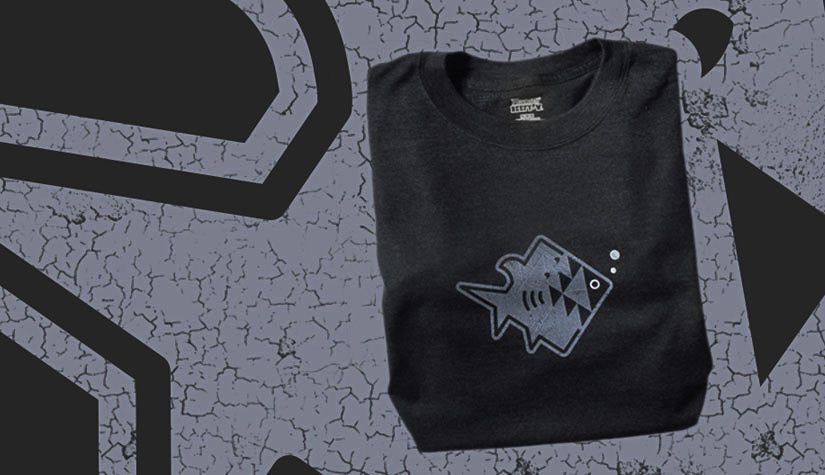 T-shirt of an illustrated fish being attacked by a shark