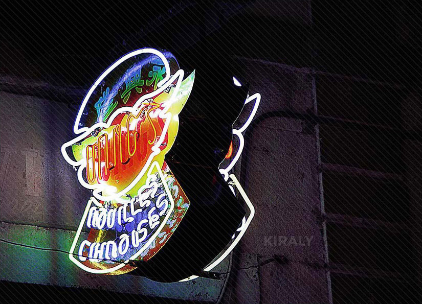 Neon restaurant sign at night