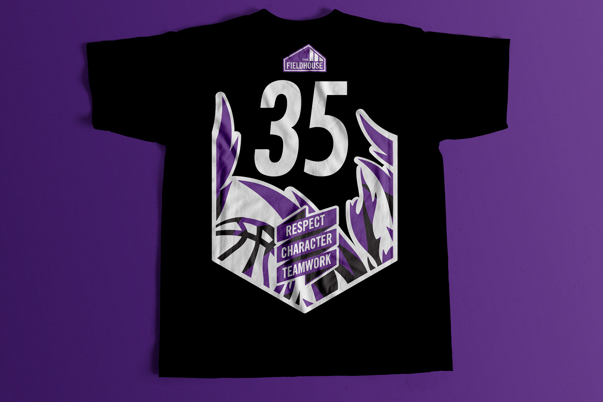Back of black shirt featuring player number and illustrative flames along with a slogan