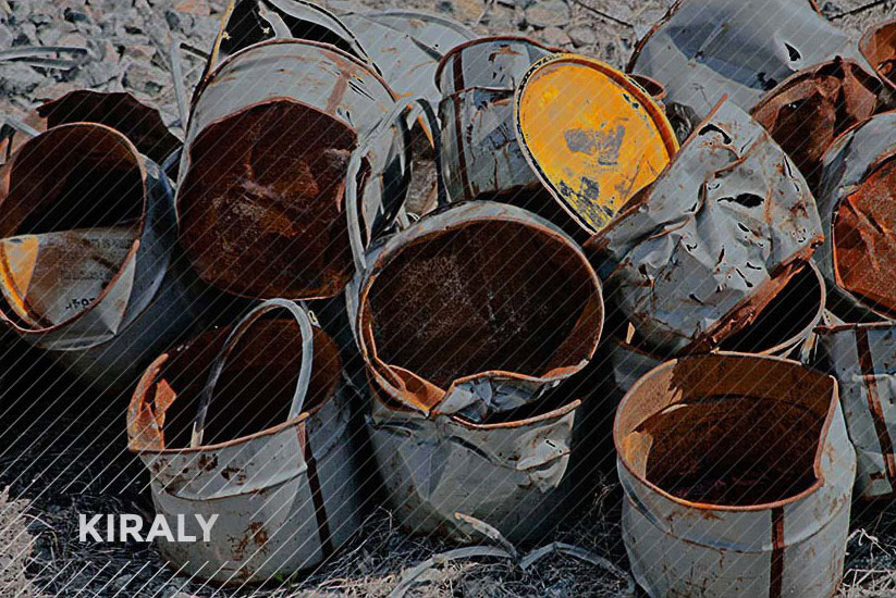 Photo of a collection of warped/dented canisters and one brightly gold painted top