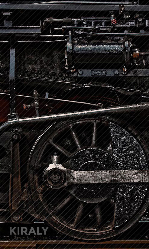 Cropped photo of train mechanical parts and wheel
