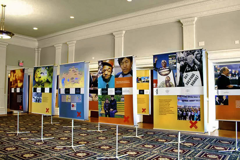 Multiple hanging posters that portray a timeline of events