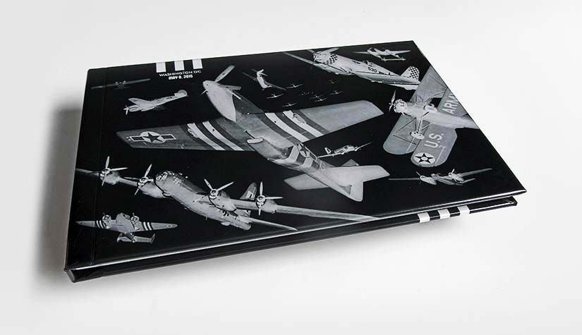 Photo of hardbound book cover that captured photos of the commemorative Washington DC flyover conducted by pilots flying vintage war planes