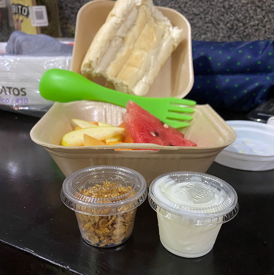 The plastic containers hold one bite each of granola and yogurt.