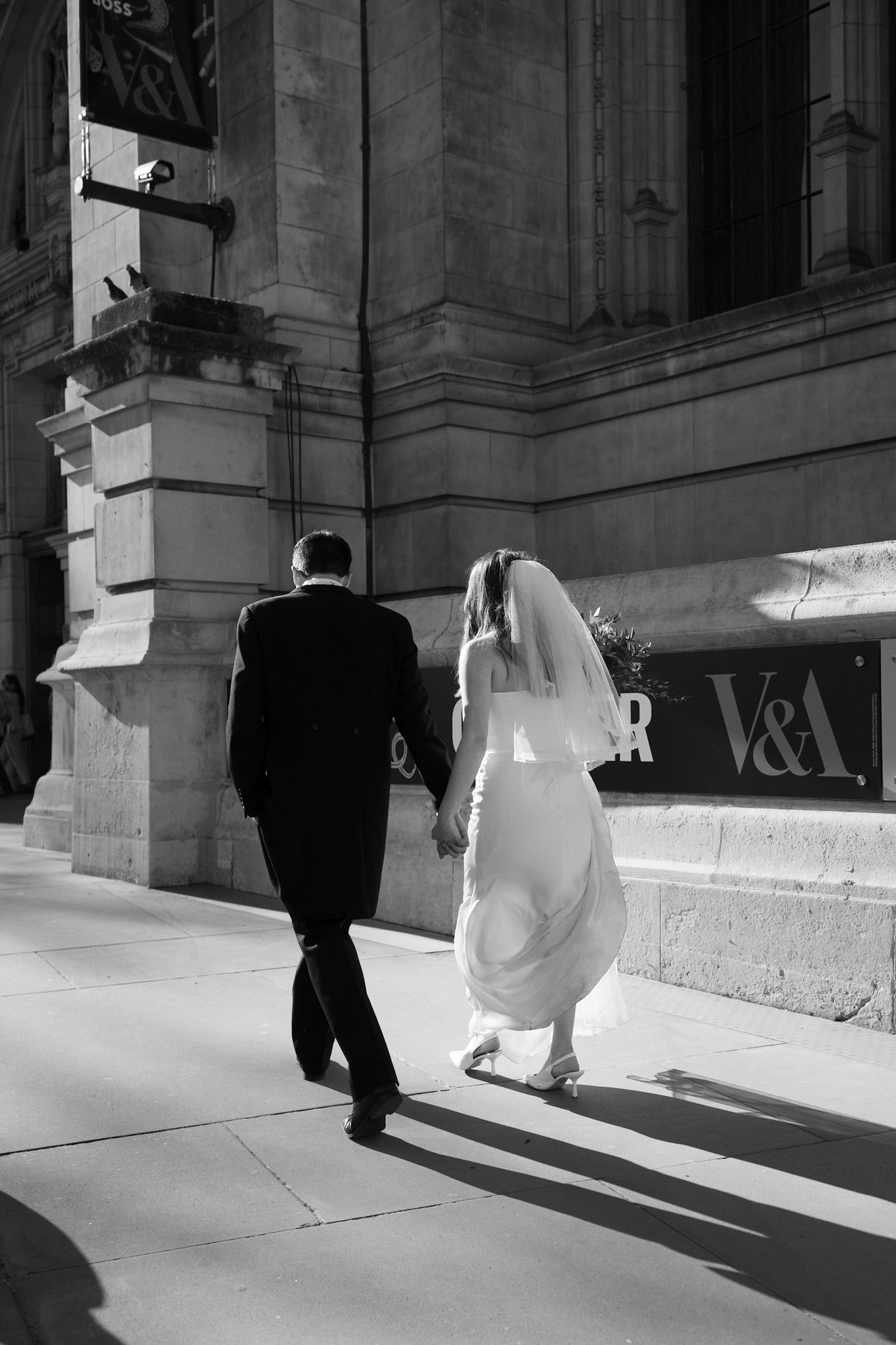 The happy couple walking in Cheslea,  London